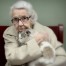 A senior citizen with her cat.